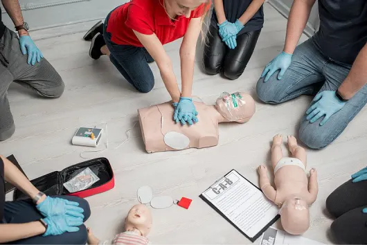 group learning cpr in first aid training course